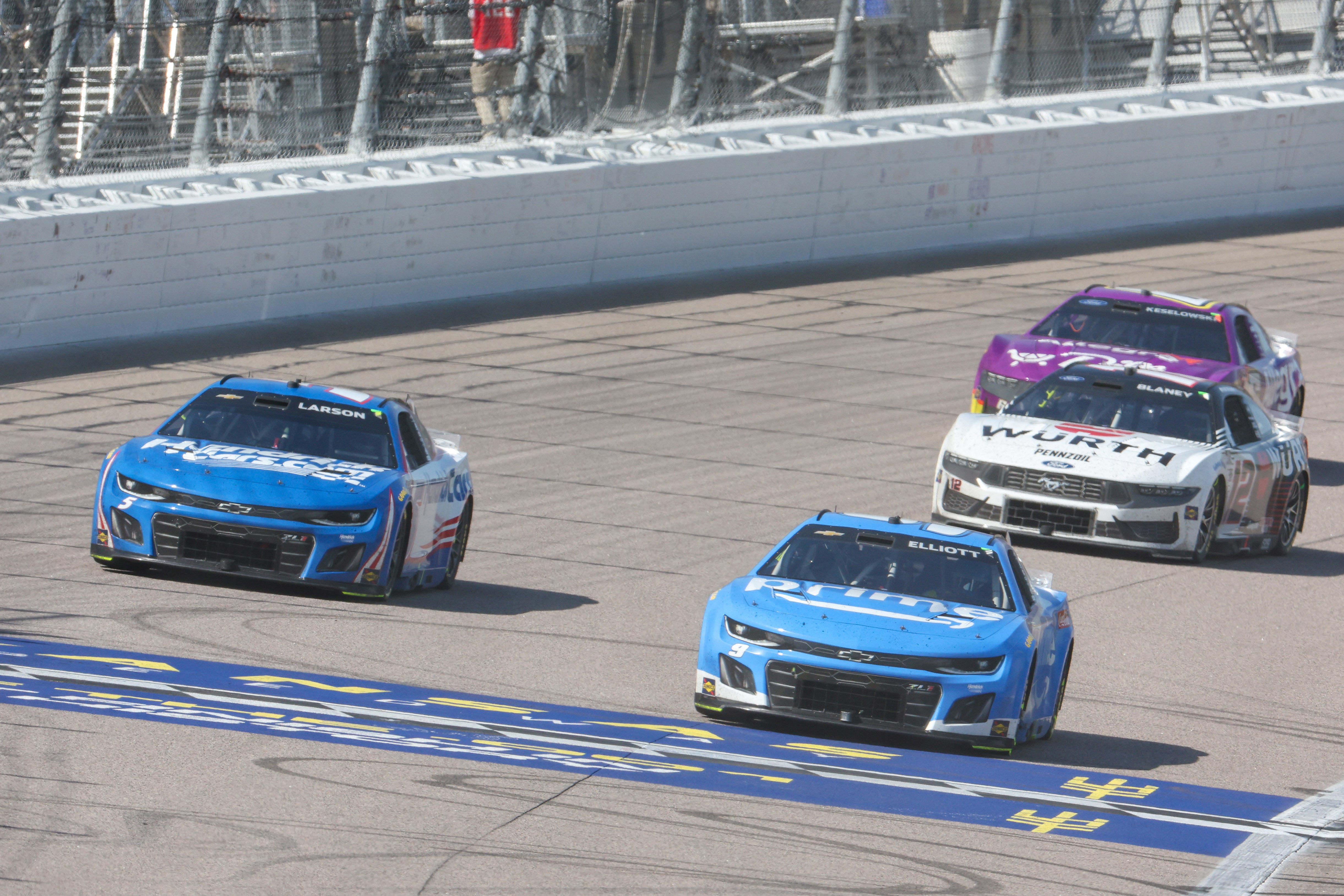 NASCAR Cup Series driver Chase Elliott (9) leads driver Kyle Larson (5) during the AdventHealth 400 at Kansas Speedway. - Source: Imagn